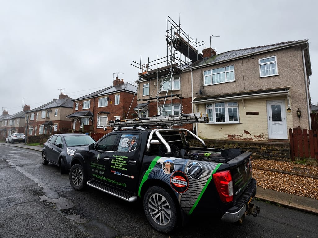 Pennine Roof Co van and scaffold tower outside a Yorkshire terrace